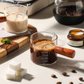 Small glass milk cup with measuring marks